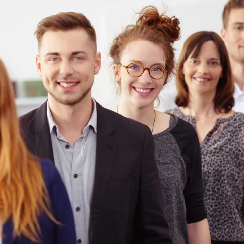 Professional translation team of five smiling certified translators ready to assist with official documents and language services.